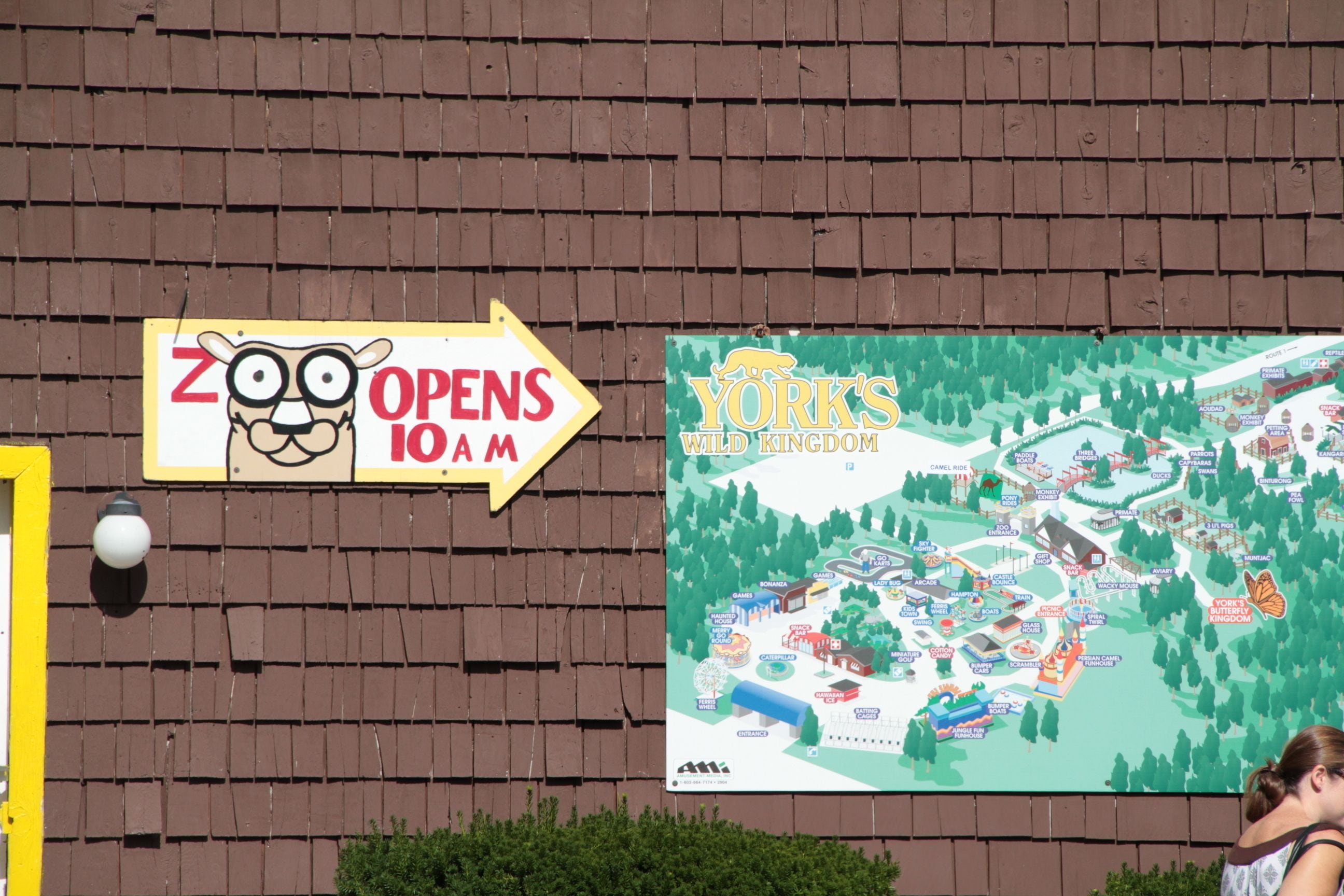 A zoo sign and a map of York's Wild Kingdom.
