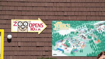 A zoo sign and a map of York's Wild Kingdom.