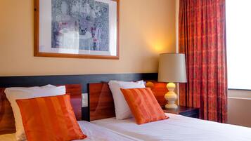 Deluxe Double Room | Minibar, in-room safe, desk, cribs/infant beds