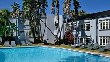 Outdoor pool, open 7:00 AM to 7:00 PM, pool umbrellas, sun loungers