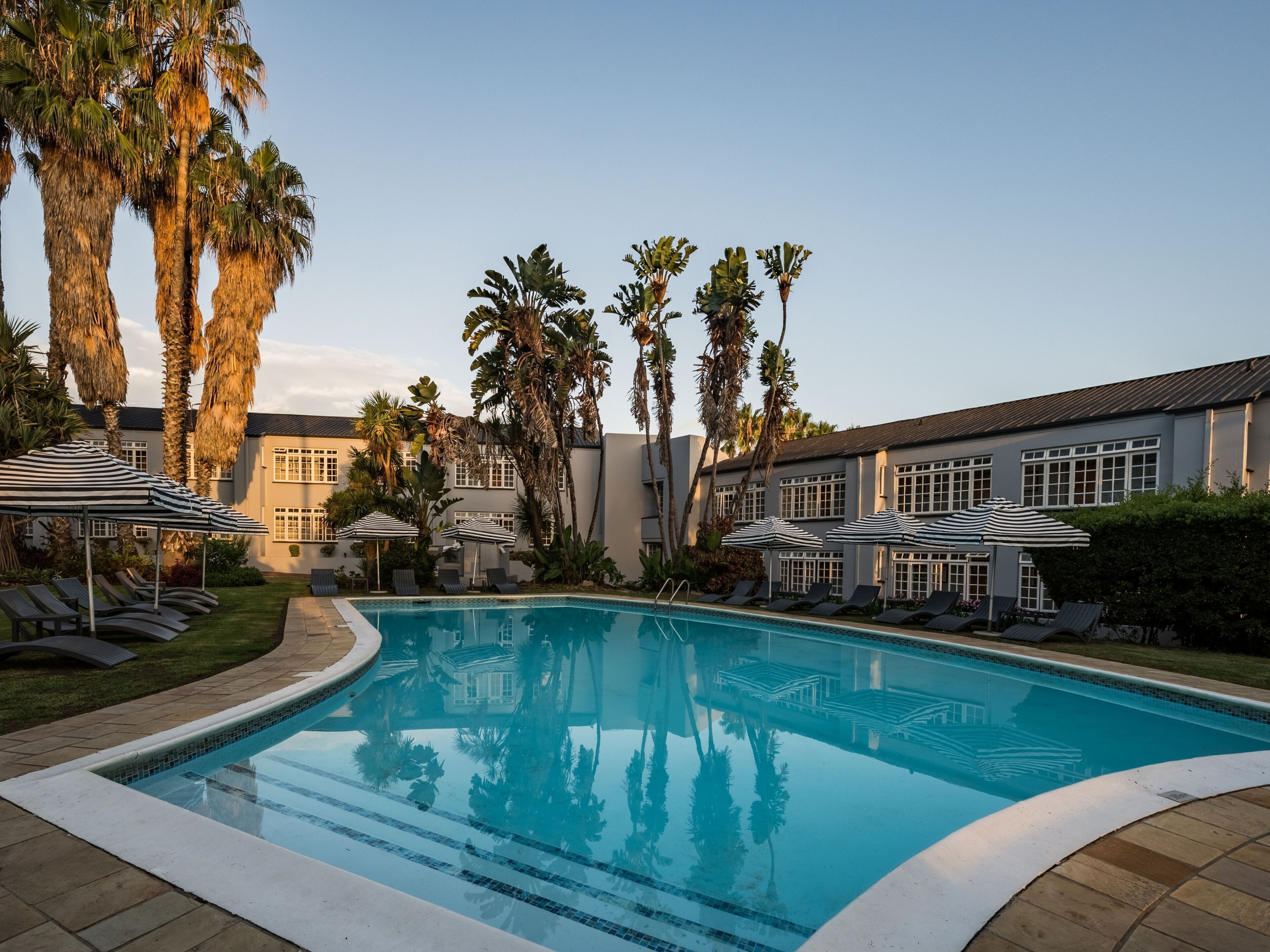 Outdoor pool, open 7:00 AM to 7:00 PM, pool umbrellas, sun loungers