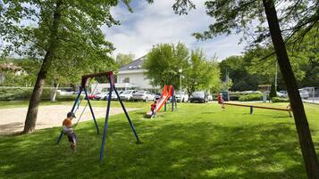 Enjoy a serene escape in this well-maintained park with a swing set and slide.
