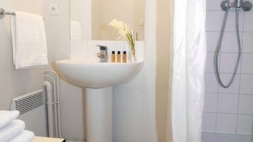 Hair dryer, towels, soap, shampoo