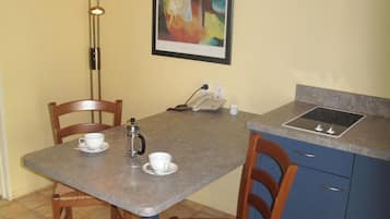 Fridge, microwave, electric kettle, cookware/dishes/utensils
