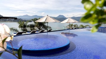 2 outdoor pools, pool umbrellas, pool loungers