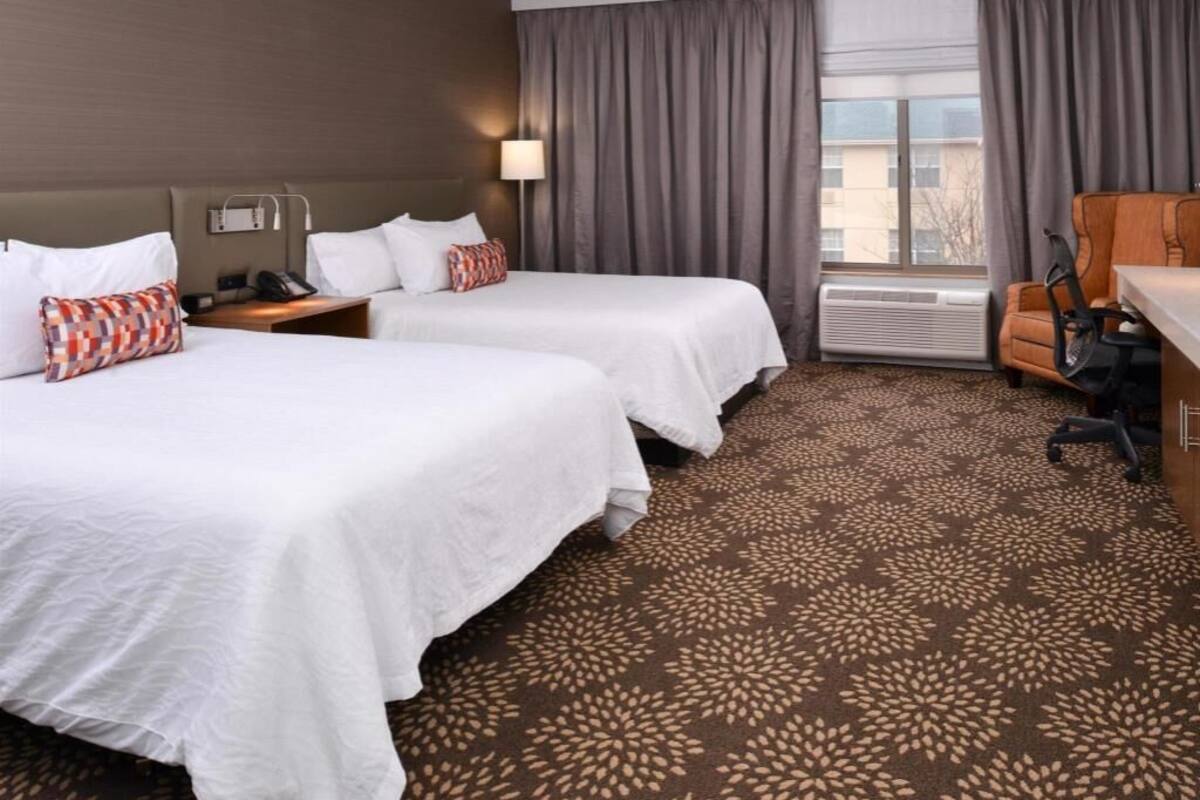 Desk, laptop workspace, blackout drapes, iron/ironing board