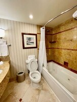 Combined shower/tub, designer toiletries, hair dryer, towels