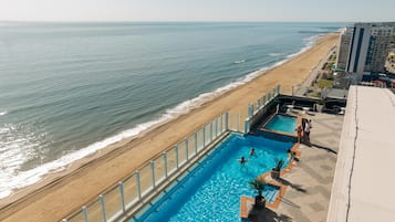 Indoor pool, seasonal outdoor pool, pool umbrellas, pool loungers