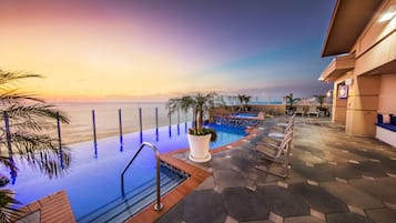 Indoor pool, seasonal outdoor pool, pool umbrellas, pool loungers