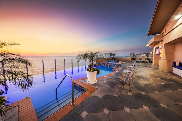 Indoor pool, seasonal outdoor pool, pool umbrellas, sun loungers