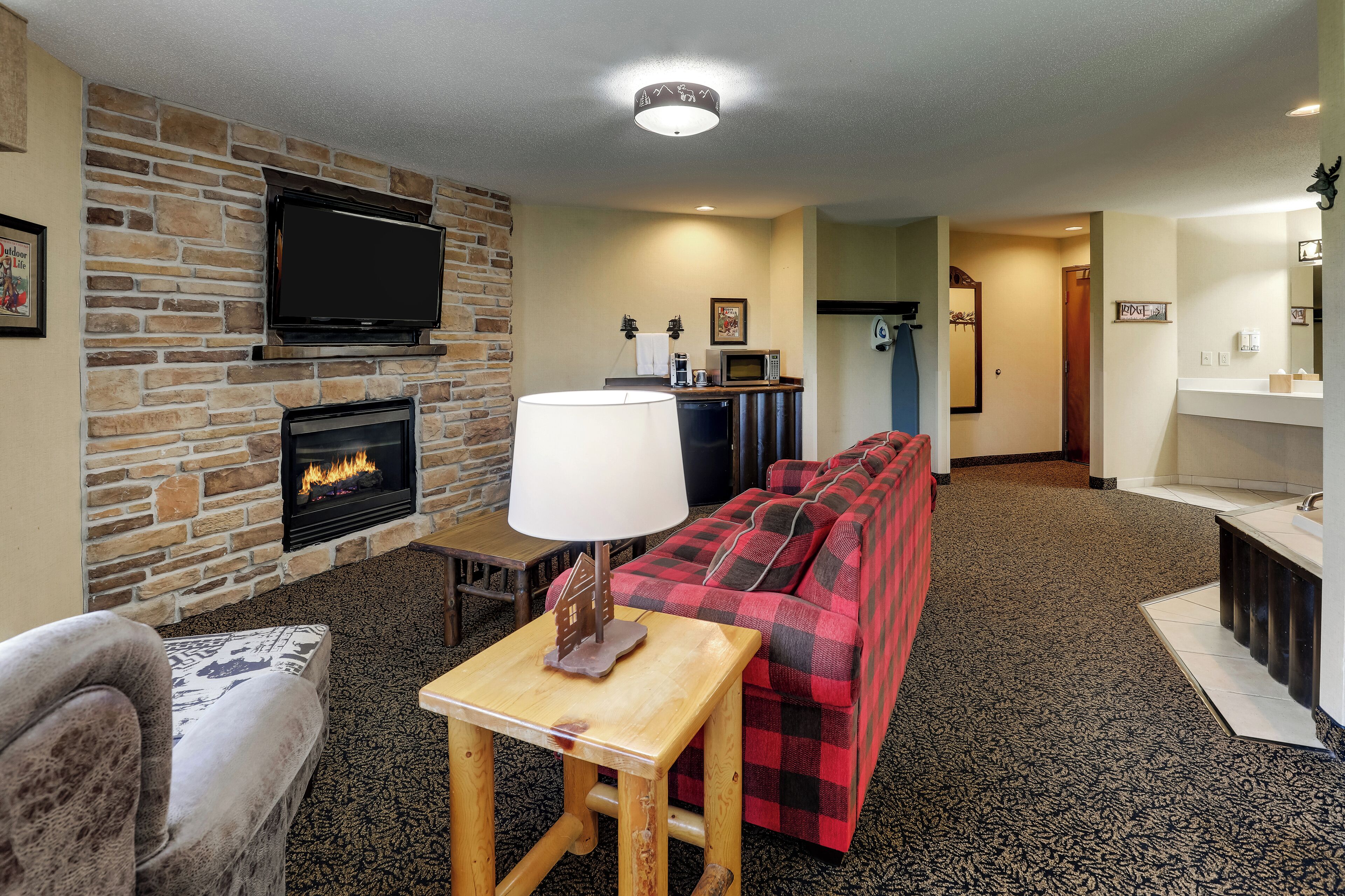 superior suite, 1 king bed with sofa bed, hot tub | desk, laptop workspace, iron/ironing board, free cots/infant beds