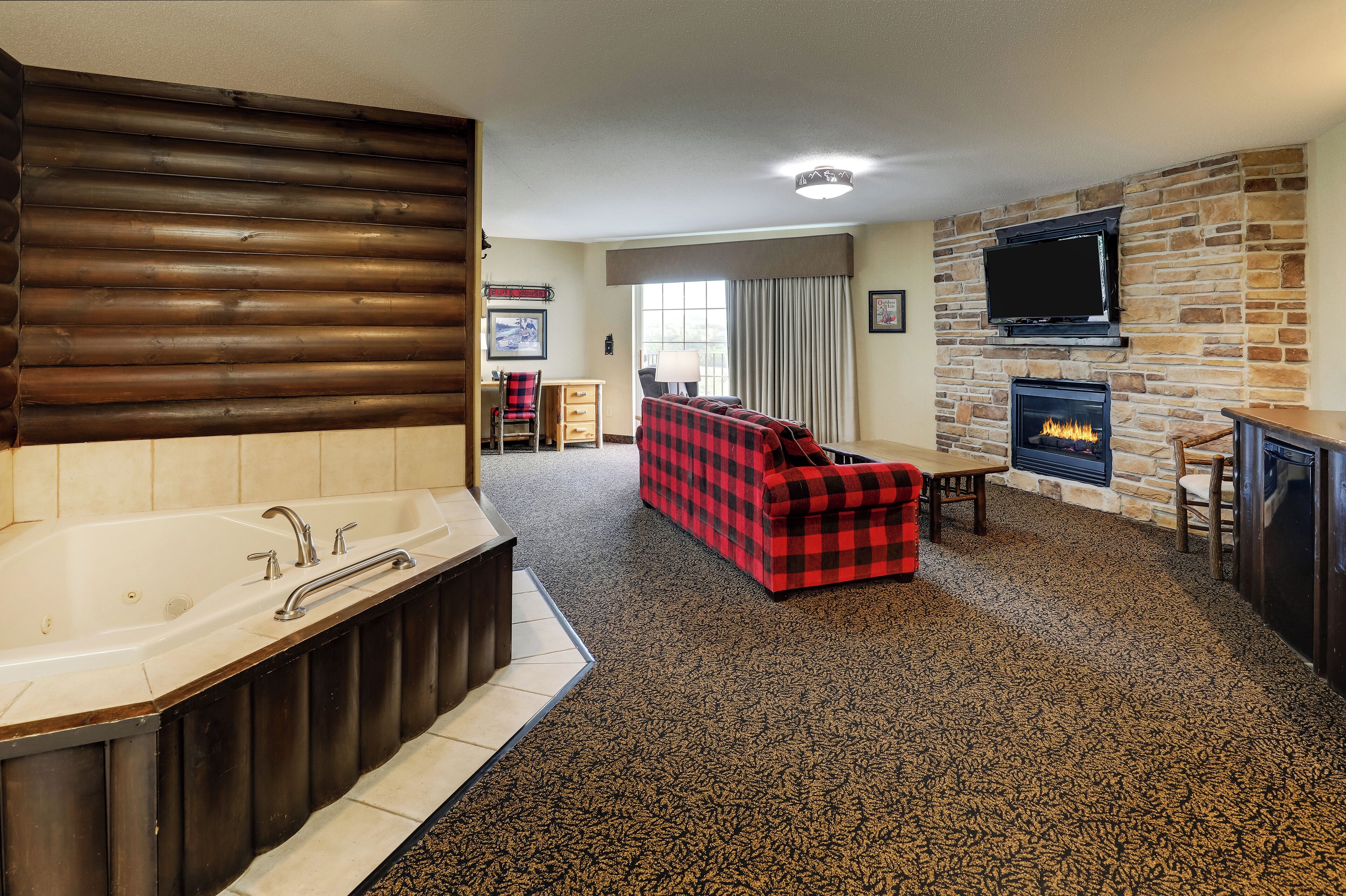 superior suite, 1 king bed with sofa bed, hot tub | desk, laptop workspace, iron/ironing board, free cots/infant beds