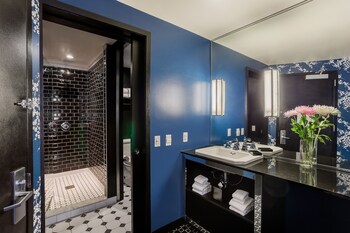 Quadruple Room | Bathroom | Eco-friendly toiletries, hair dryer, towels, soap at 45 Times Square Hotel