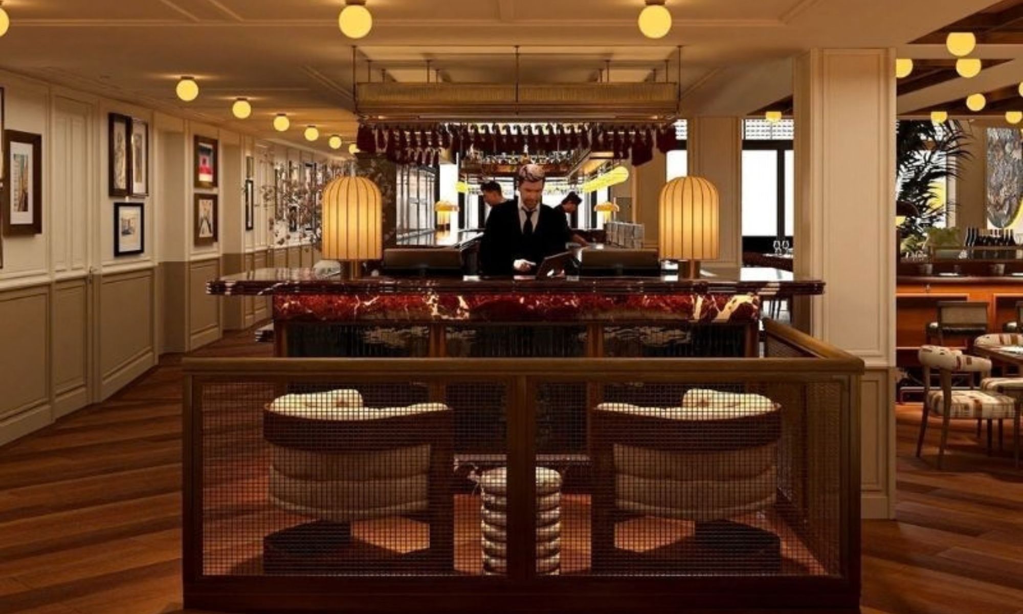 A bar area with a counter, two bar stools, and a bartender.