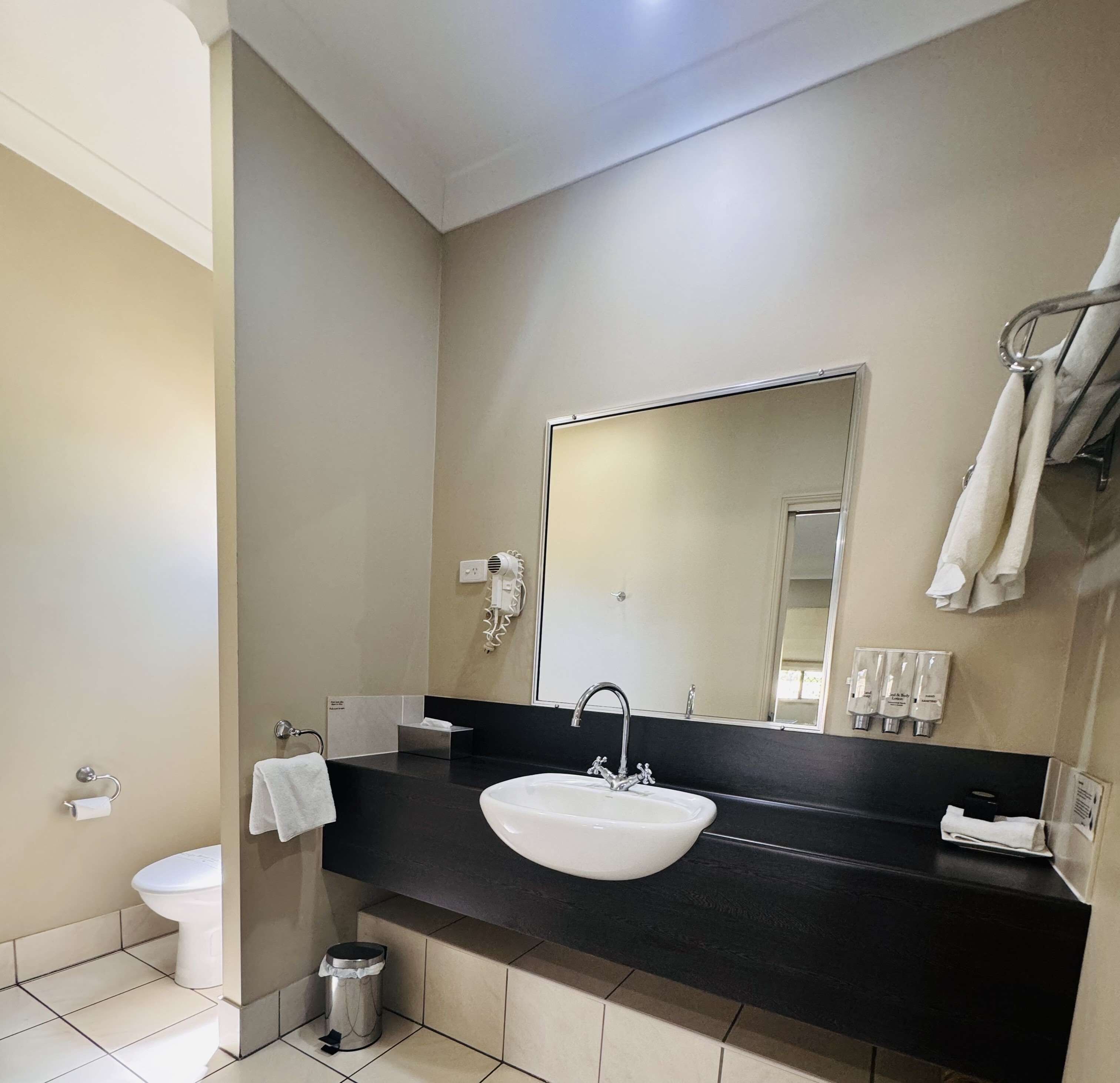 deluxe room, multiple beds, non smoking | bathroom | free toiletries, hair dryer, towels