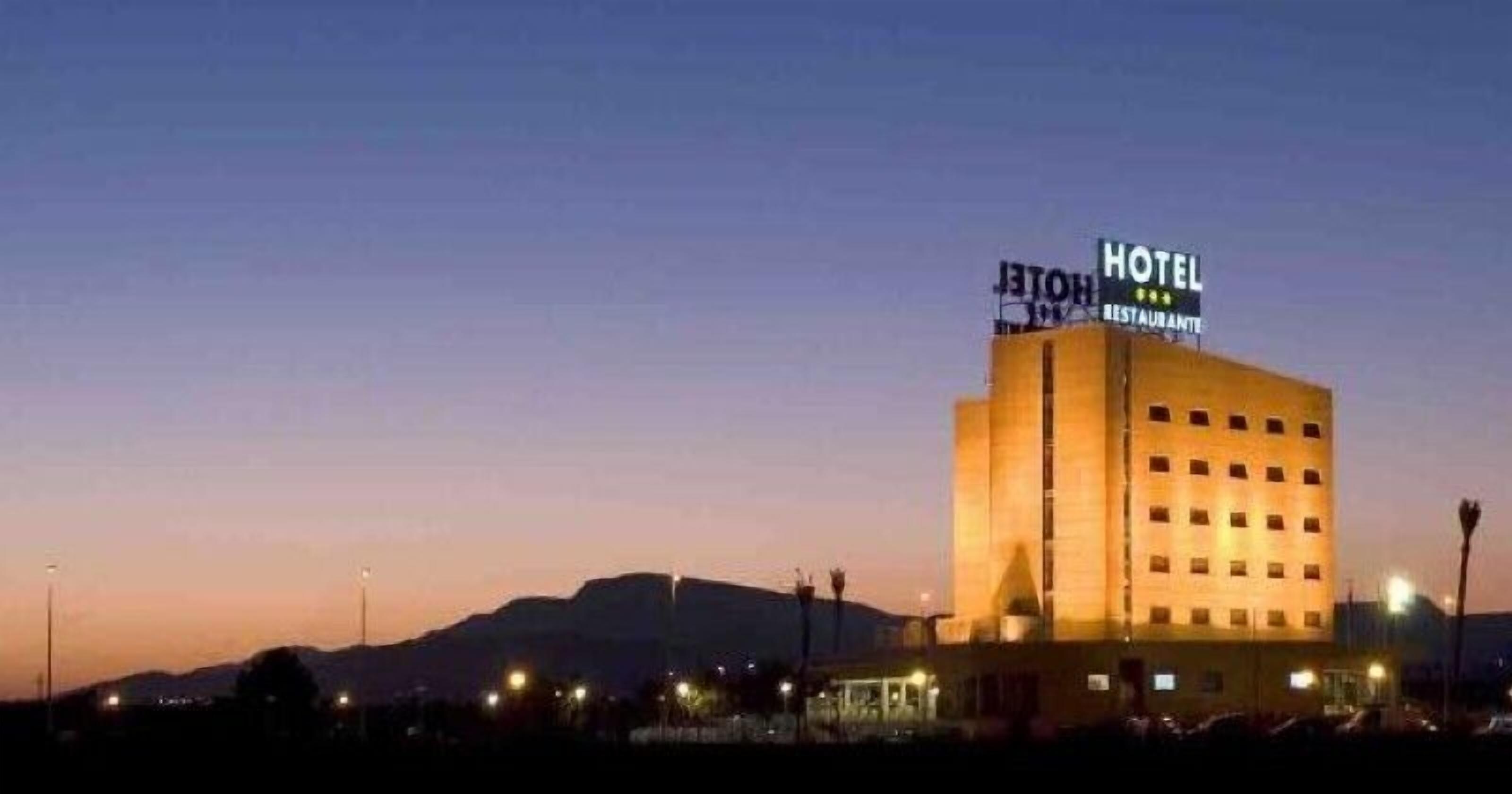 A hotel with a sign indicating it includes a restaurant.