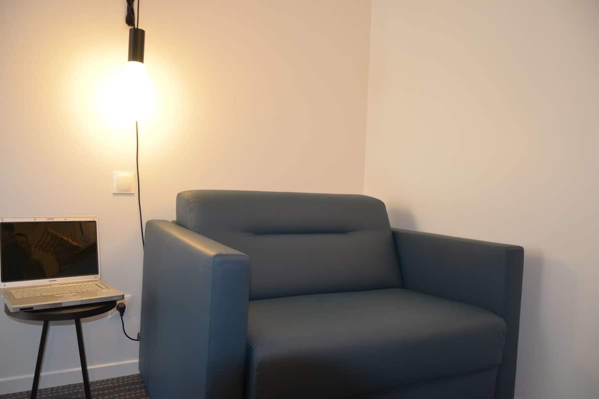 premium bedding, desk, laptop workspace, blackout curtains