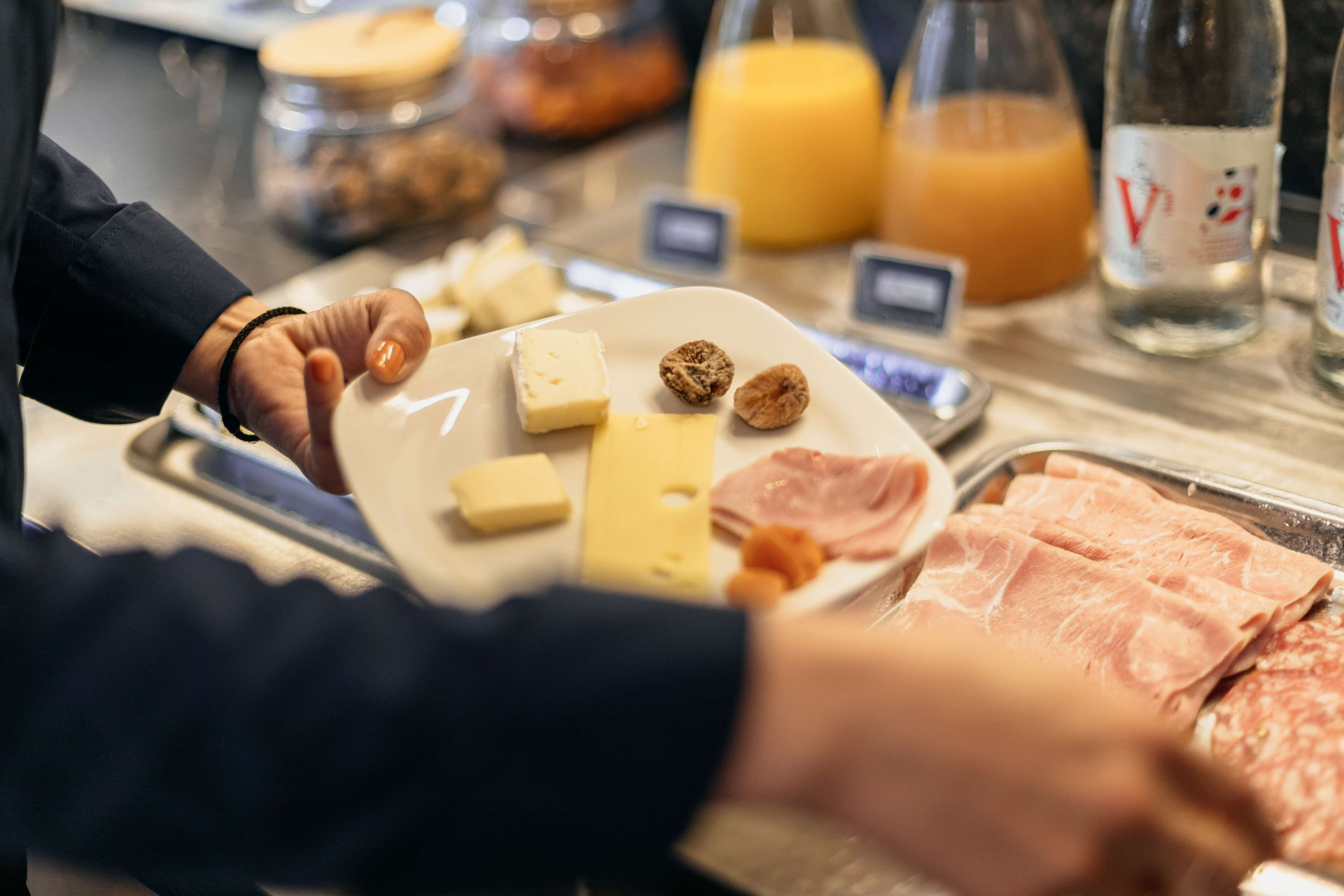 A breakfast buffet with various food items and beverages.