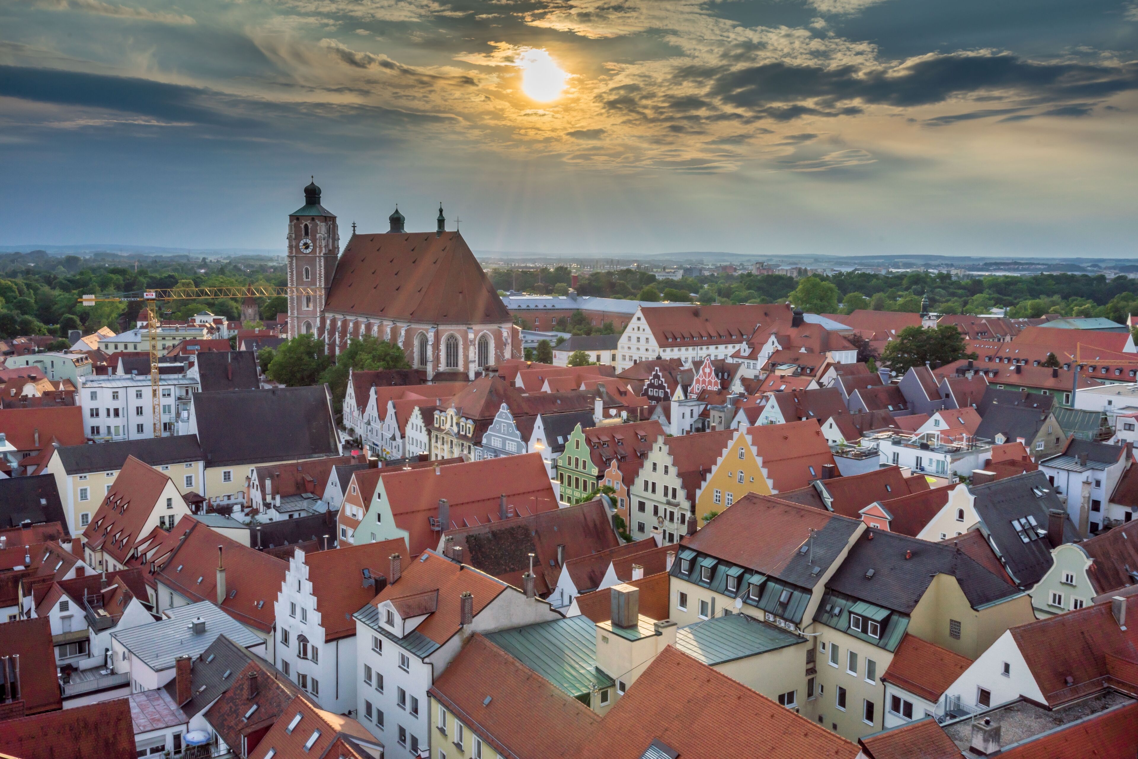 A historic town with a prominent church and a clock tower.