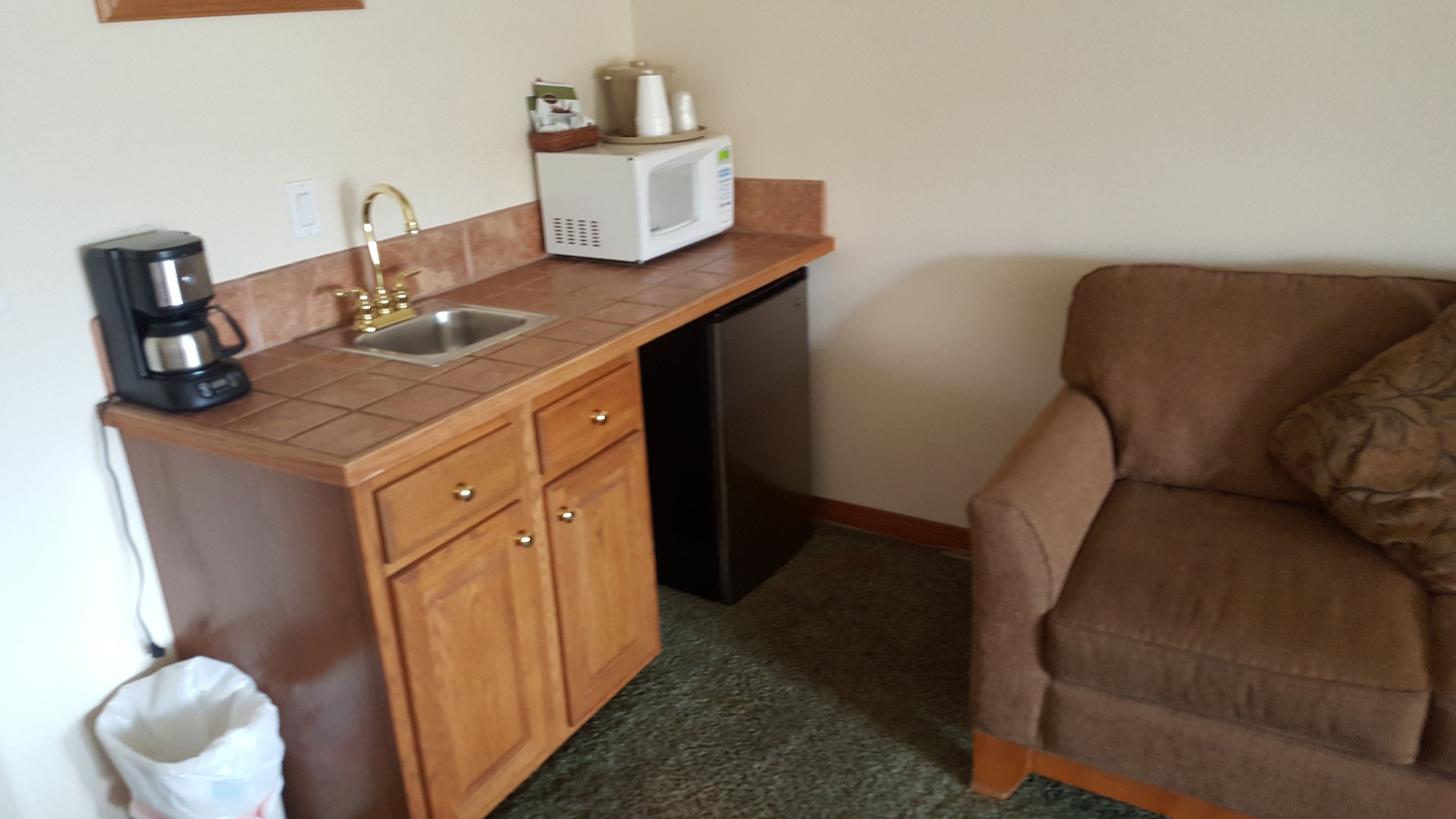 premium room, 1 king bed (spa room) | private kitchenette | coffee/tea maker