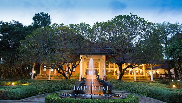 A resort with a central fountain, surrounded by well-maintained gardens and trees. - The Imperial Chiang Mai Resort & Sports Club (Mae Rim)