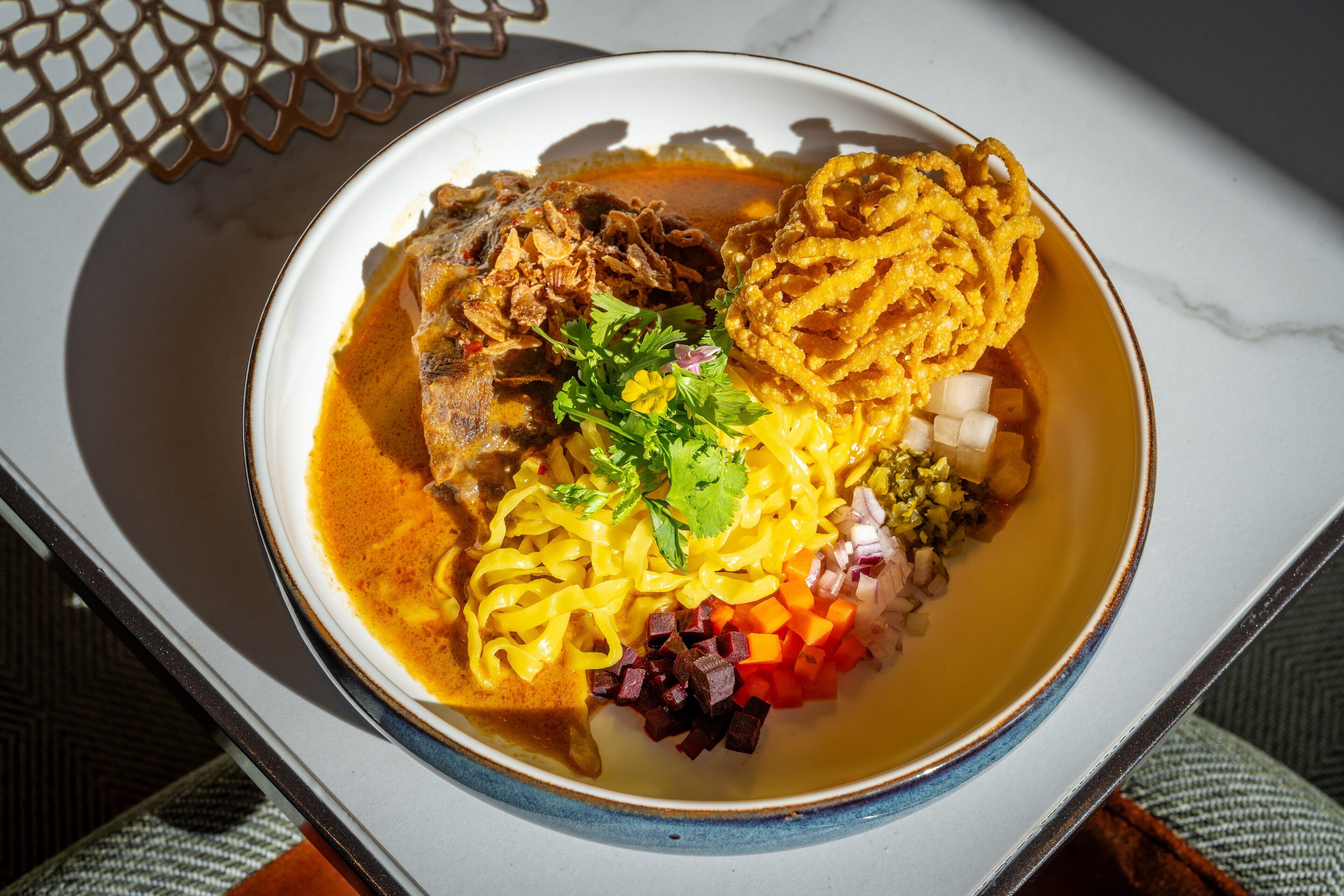 A bowl of soup with various ingredients.