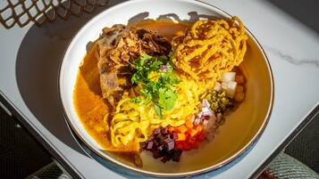 A bowl of soup with various ingredients.