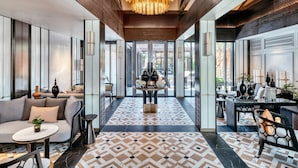 A spacious lobby with a patterned floor, a central chandelier, and seating areas on either side. - InterContinental Chiang Mai The Mae Ping by IHG (Chiang Mai)