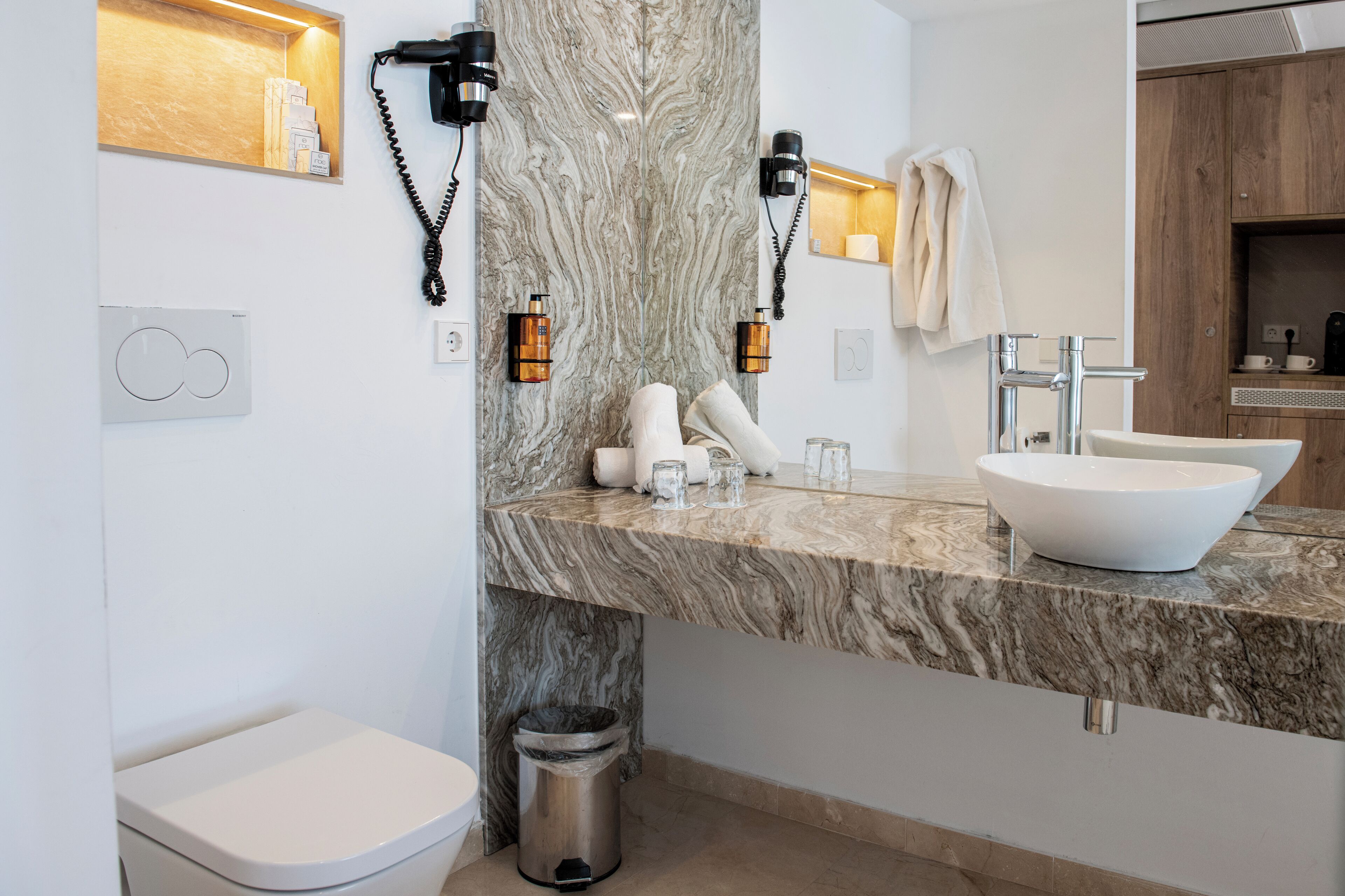 eco-friendly toiletries, hair dryer, bathrobes, slippers