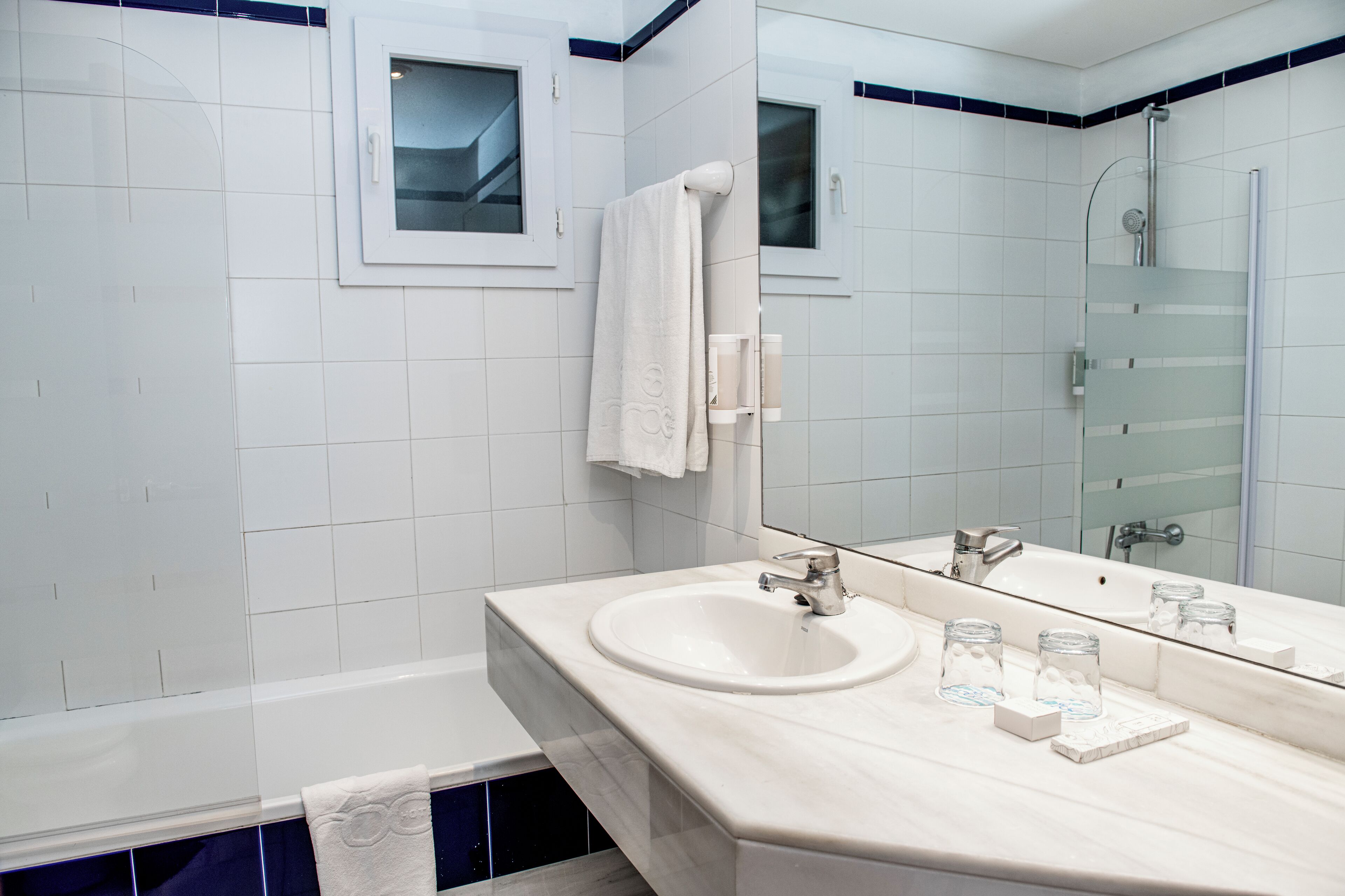 eco-friendly toiletries, hair dryer, bathrobes, slippers