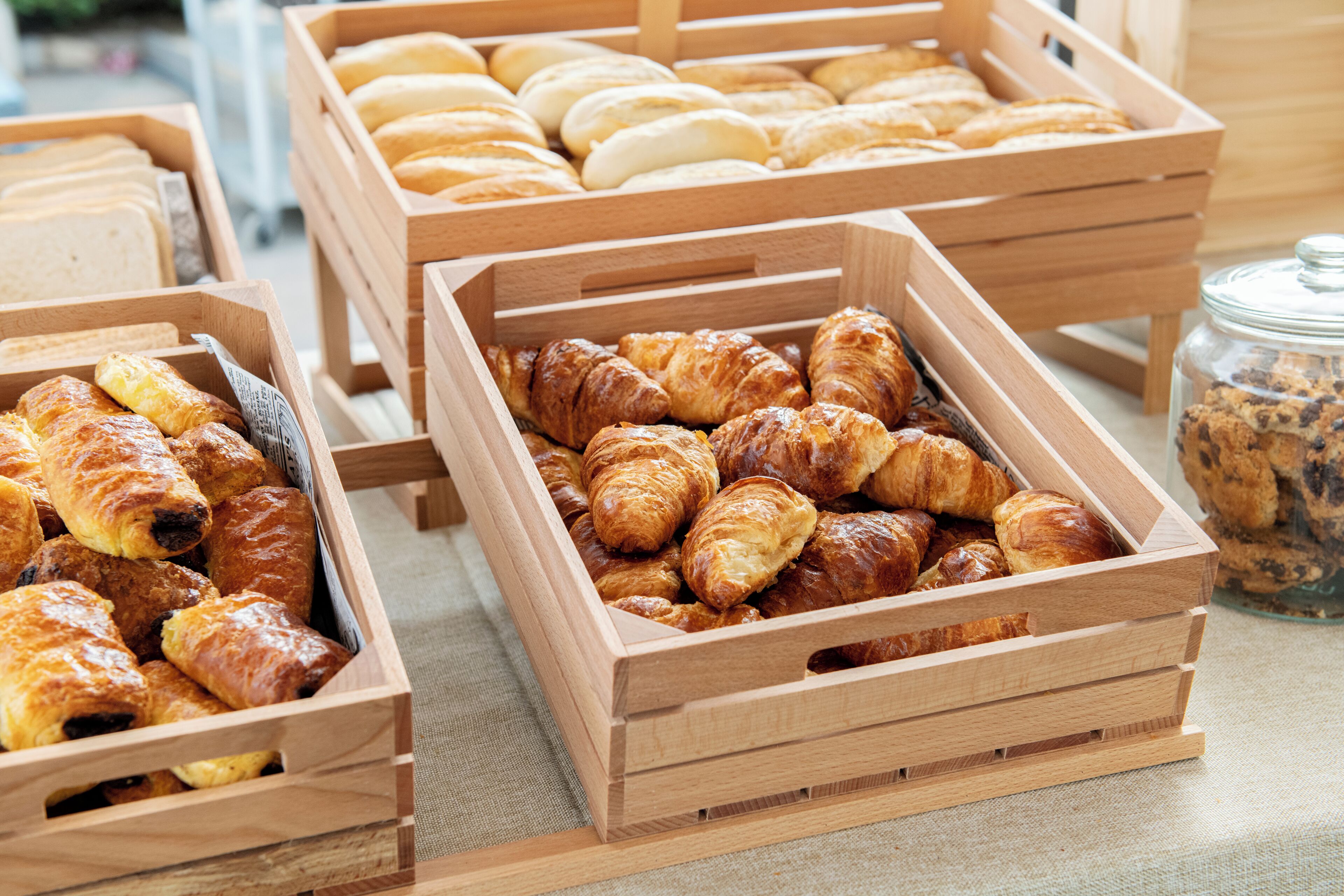 Wooden crates filled with various pastries.