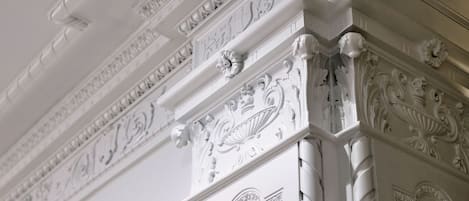 A detailed architectural column with ornate carvings and a classical design.