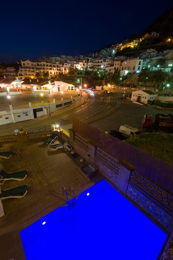 Seasonal outdoor pool, pool umbrellas, pool loungers