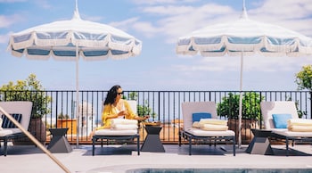 Outdoor pool, open 7:00 AM to 11:00 PM, sun loungers at Kimpton Canary Hotel by IHG