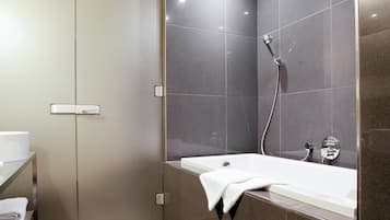 Combined shower/bathtub, hair dryer, bathrobes, slippers