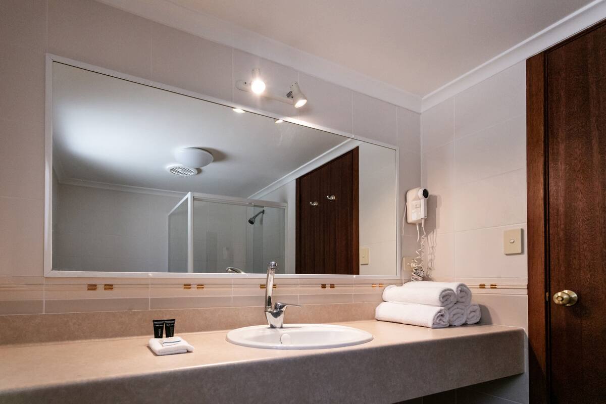 eco-friendly toiletries, hair dryer, towels