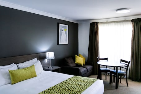 Suite, 1 King Bed, Non Smoking (Dining Table) | 1 bedroom, premium bedding, minibar, desk