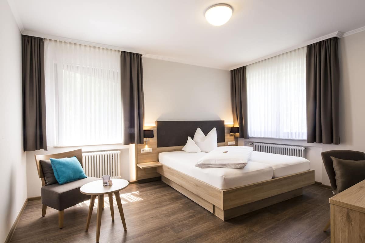 hypo-allergenic bedding, down duvets, minibar, in-room safe