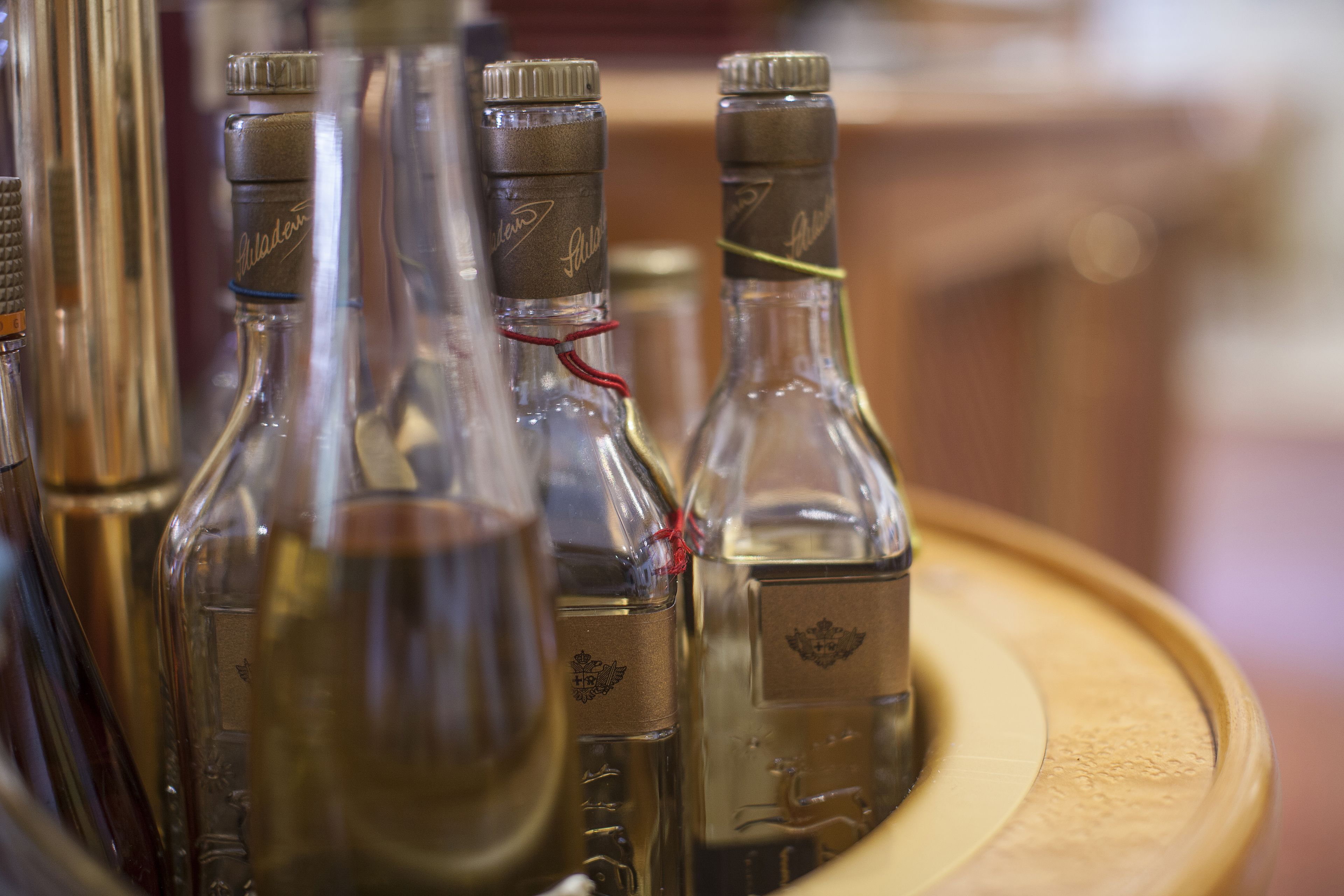 A tray with several empty glass bottles, likely for beverages.