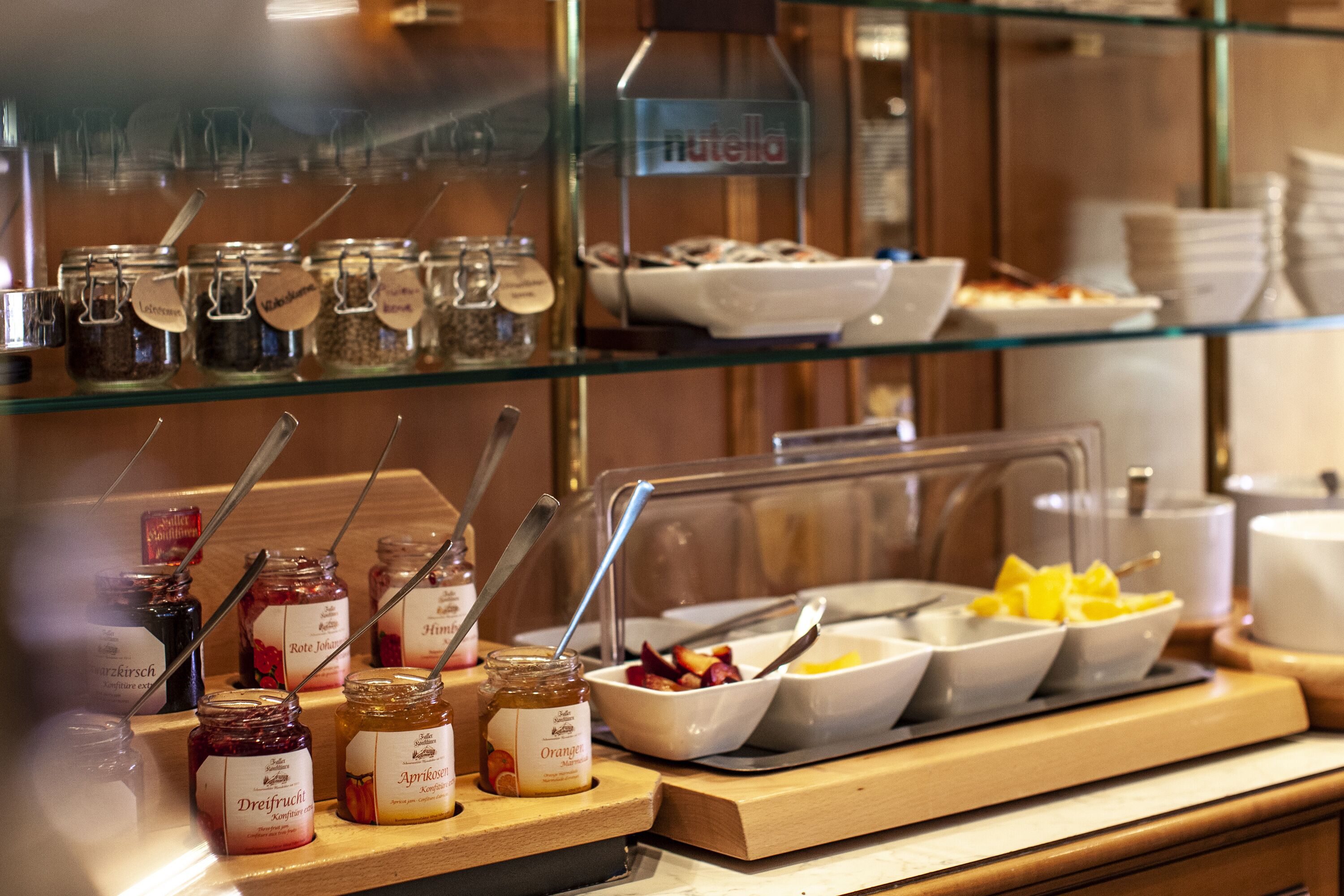 A buffet with various food items and condiments.