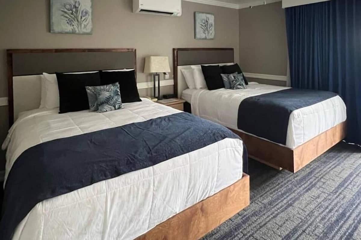 Standard Room, 2 Queen Beds, Non Smoking | Desk, laptop workspace, blackout drapes, free WiFi