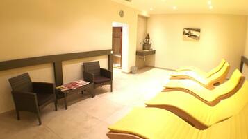 Relax in a serene space with a reception area, massage chairs, and a self-service bathroom.