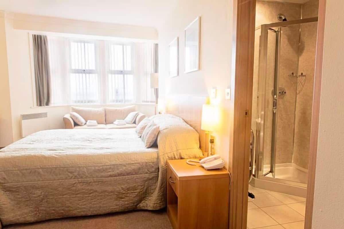 family room, sea view | in-room safe, desk, iron/ironing board, free wifi