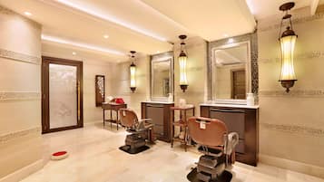 Experience a professional grooming area with three hairdressing chairs, mirrors, and sinks.