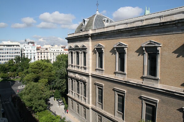 A historic building with classical architecture, featuring symmetrical windows and a prominent dome.
