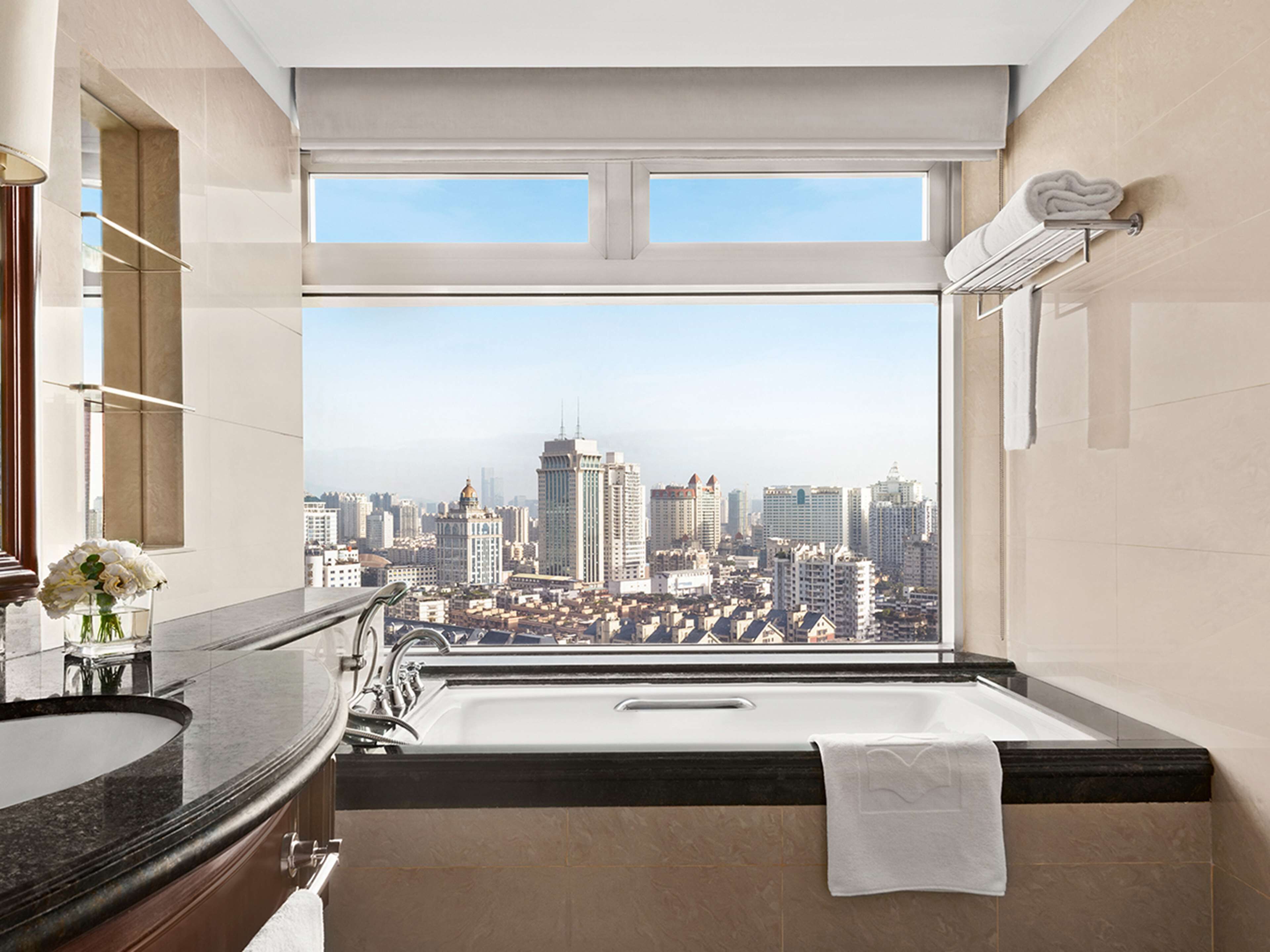 separate bathtub and shower, rainfall showerhead, designer toiletries