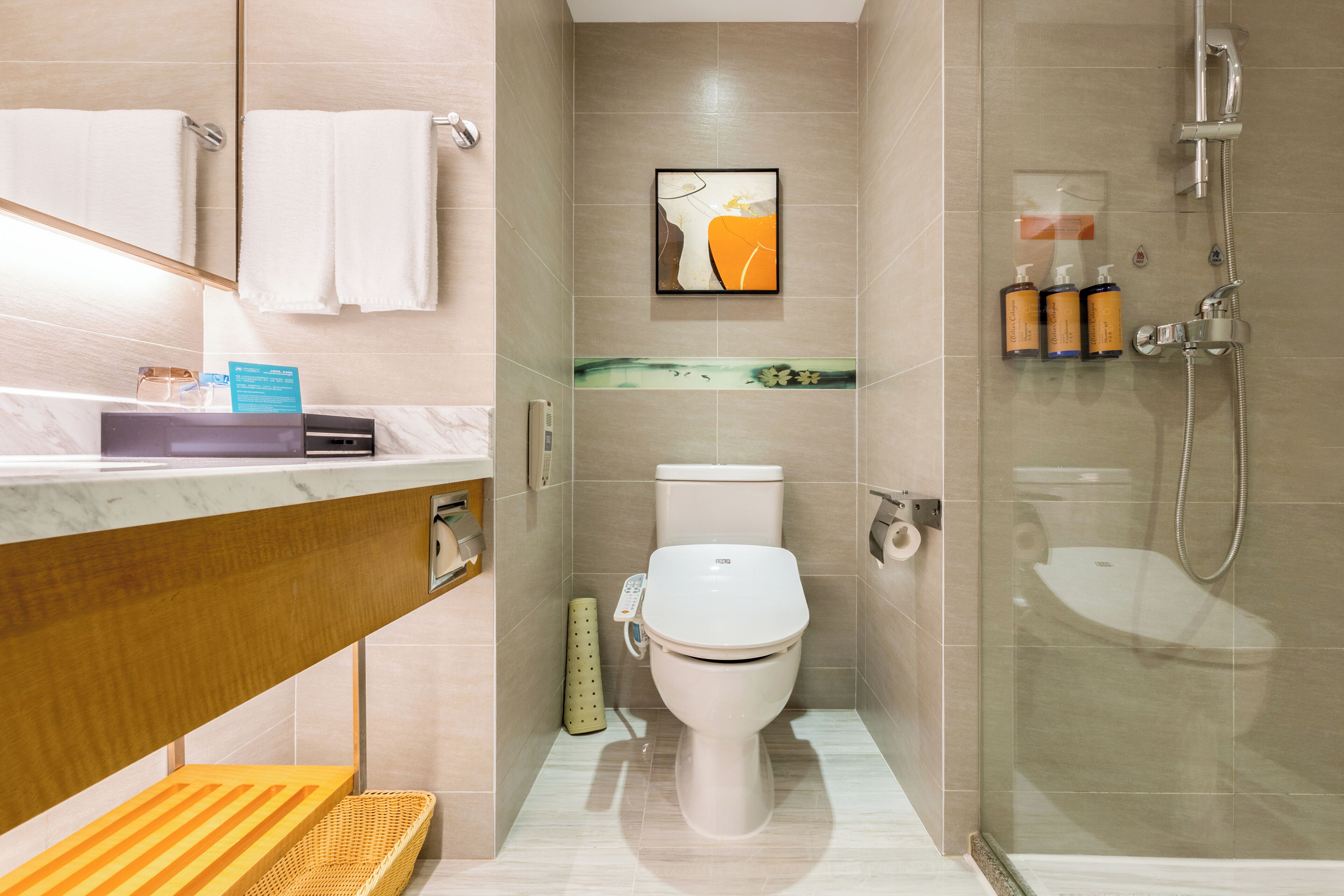 designer toiletries, hair dryer, bathrobes, slippers