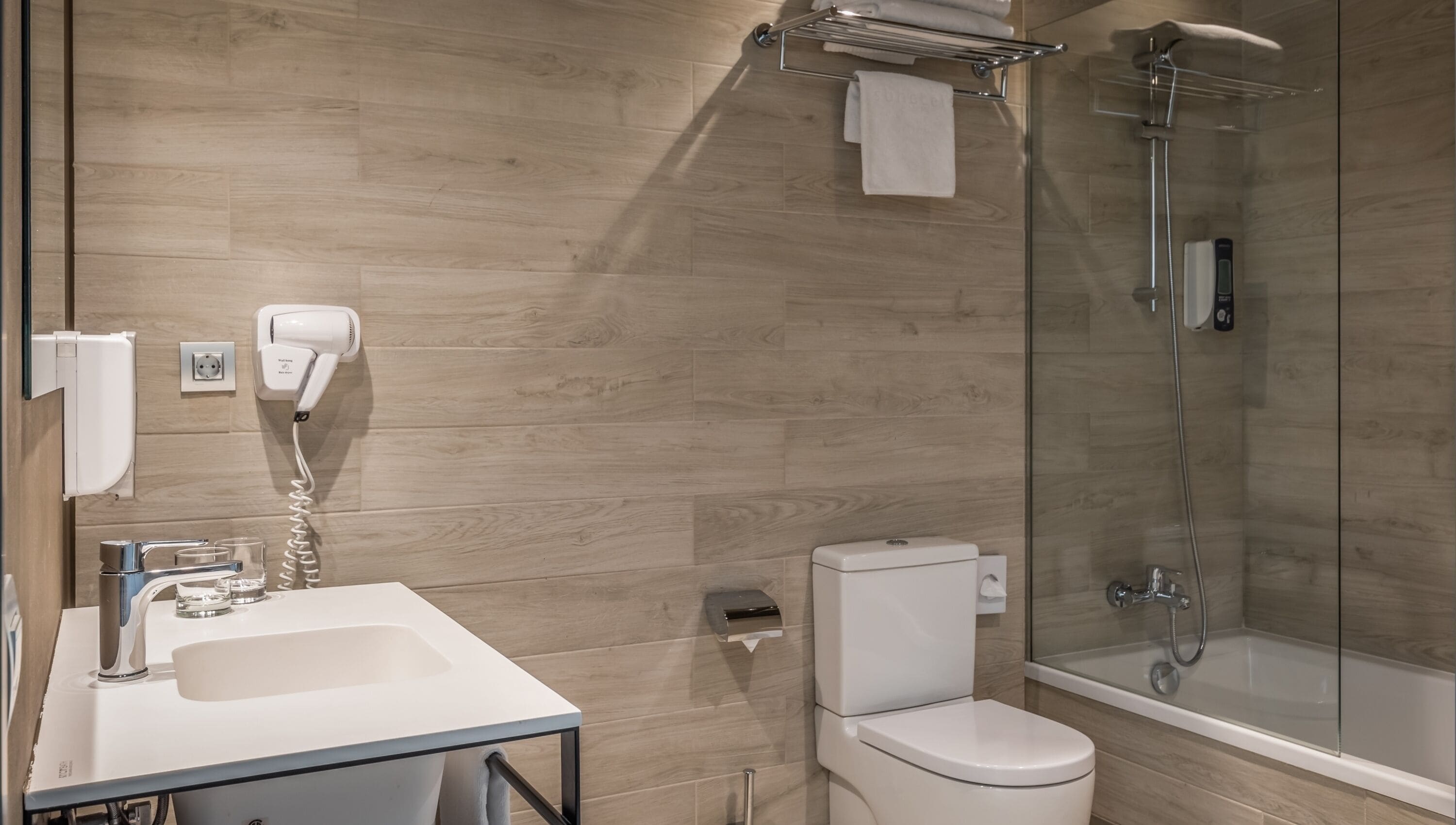 designer toiletries, hair dryer, towels, soap