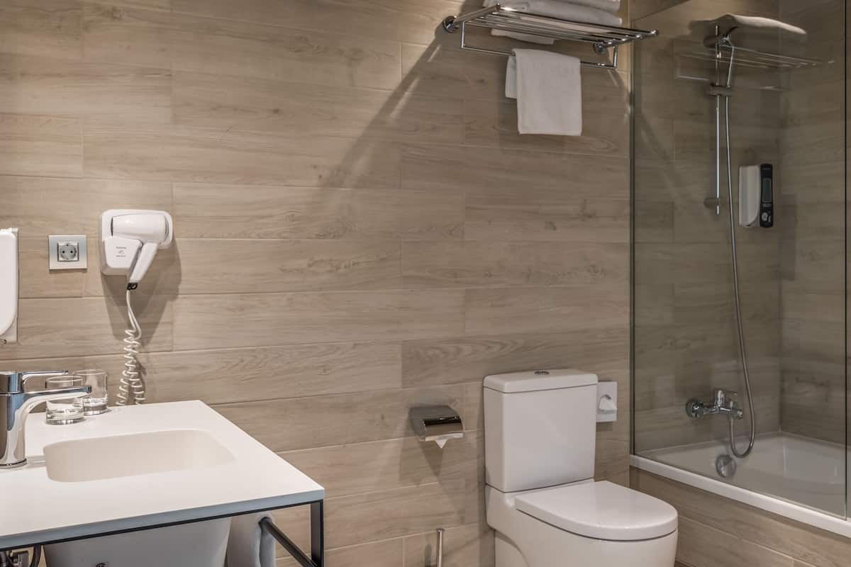 designer toiletries, hair dryer, towels, soap