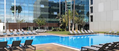 Seasonal outdoor pool, open 11:00 AM to 7:00 PM, sun loungers